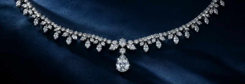 Midnight sparkle — a diamond necklace on navy velvet, an ARIYA editorial concept.